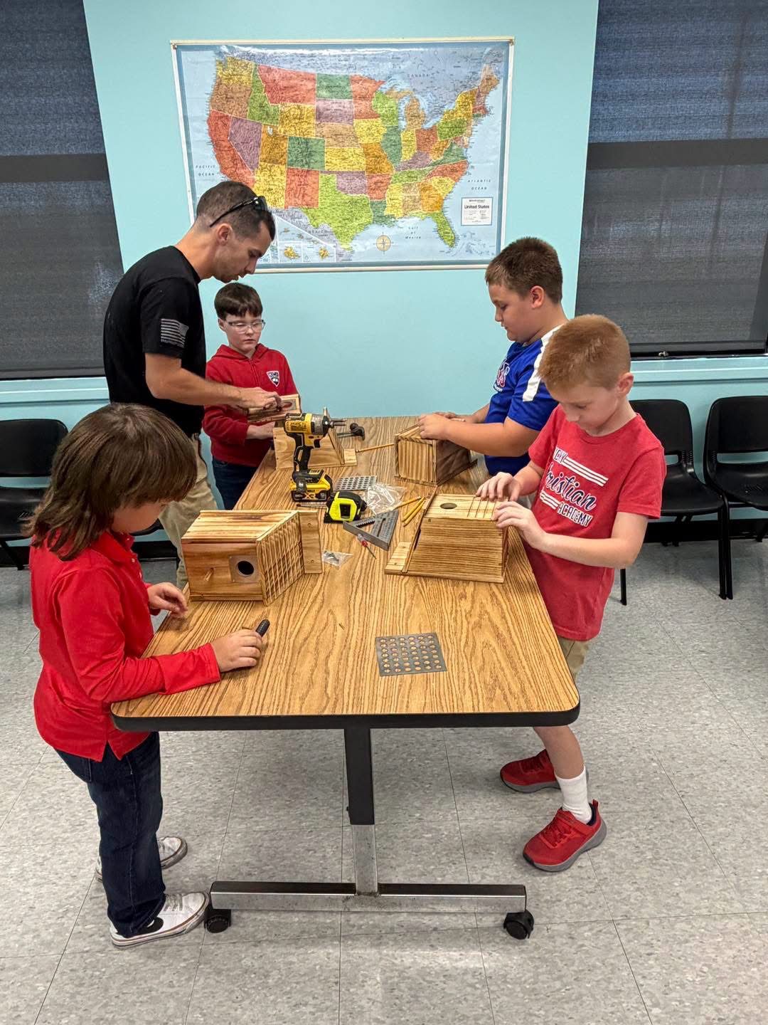 KCA students building birdhouses